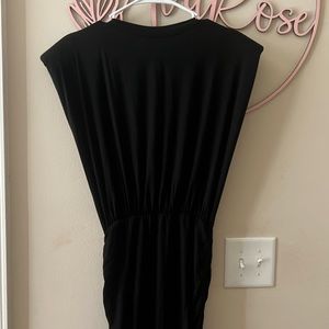 Black body con dress with shoulder pads and ruching detail
